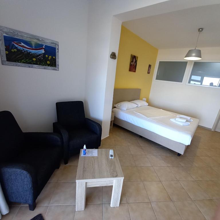 A bed or beds in a room at Rooms Kavala