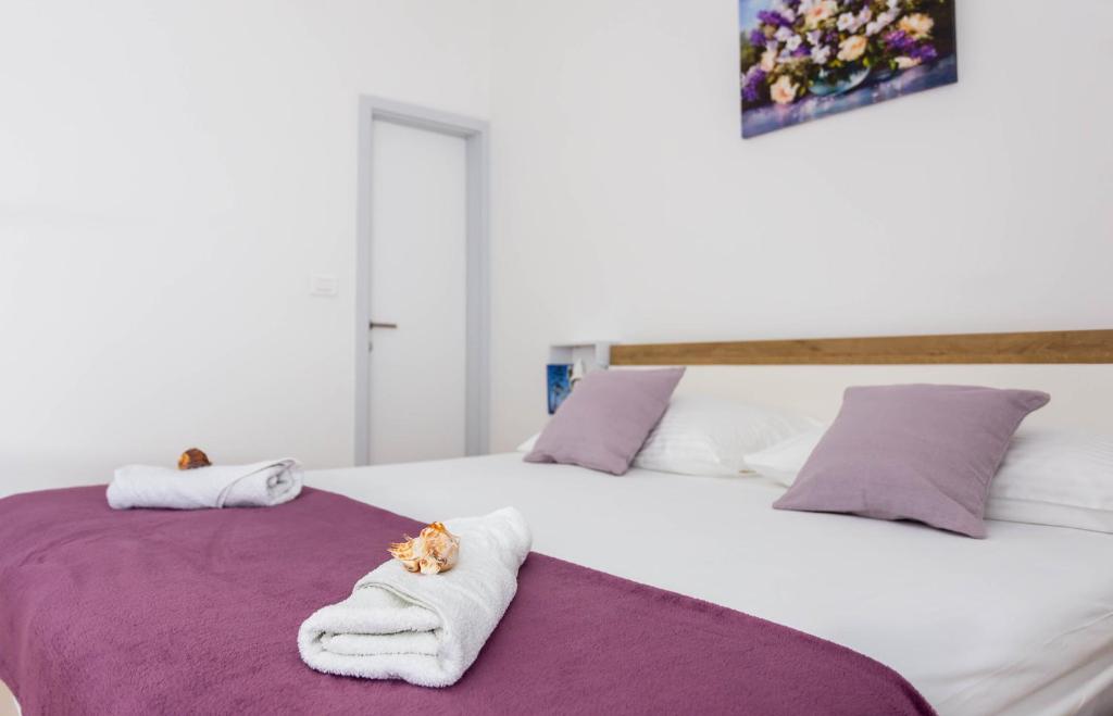 Postel nebo postele na pokoji v ubytování Villa Silvana