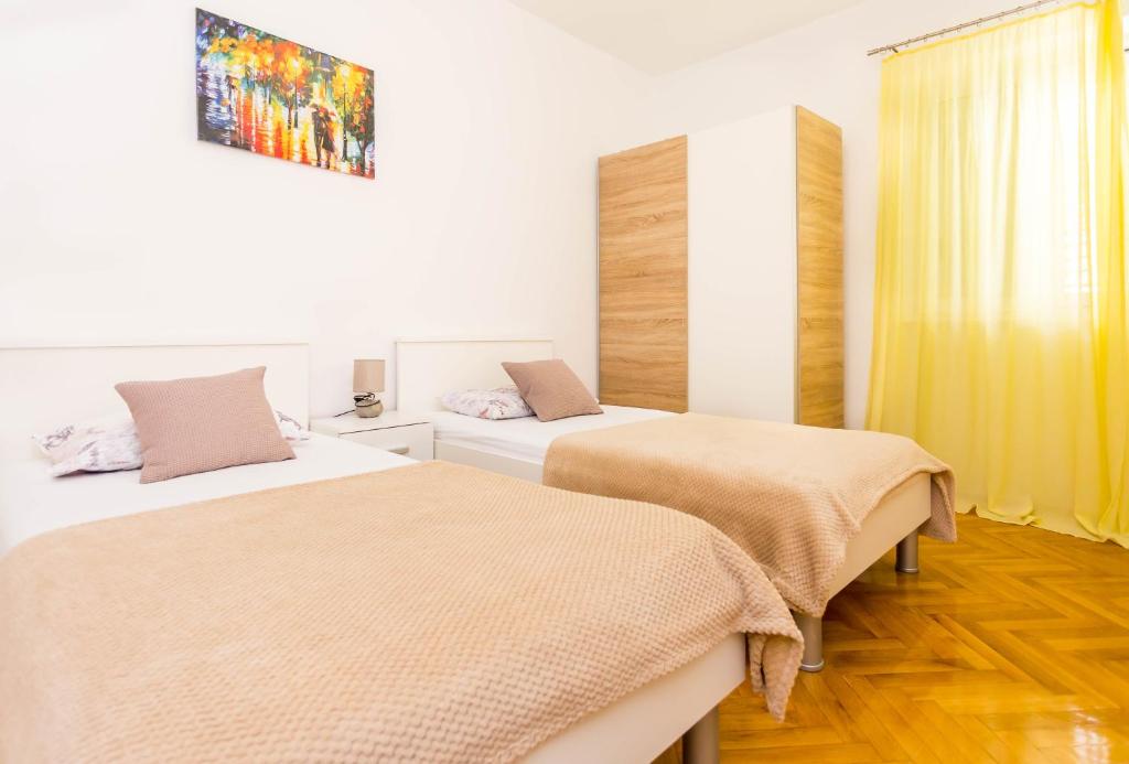 Postel nebo postele na pokoji v ubytování Villa Silvana