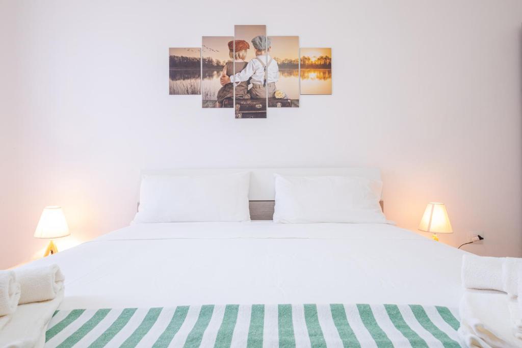 Postel nebo postele na pokoji v ubytování Apartment Mikao - Torre Pali