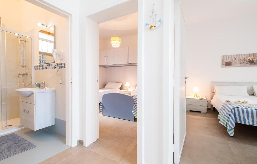 Postel nebo postele na pokoji v ubytování Apartment Mikao - Torre Pali