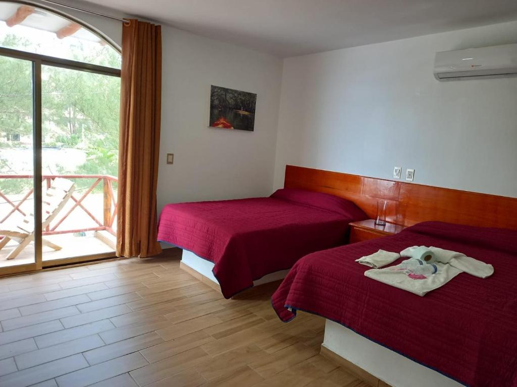 Postel nebo postele na pokoji v ubytování Hotel El Rincon de Don Juan
