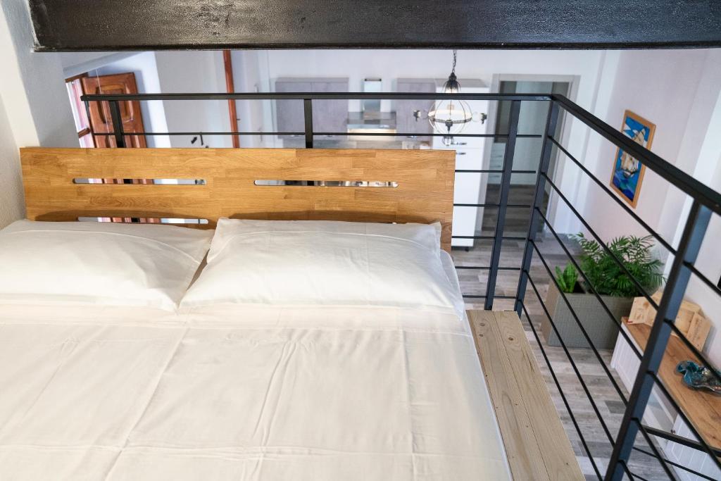 Posteľ alebo postele v izbe v ubytovaní Villanova Loft