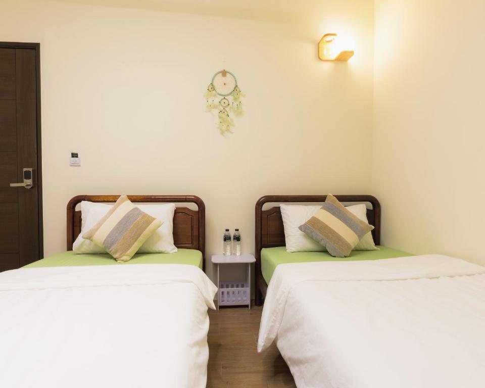 Postel nebo postele na pokoji v ubytování Hello Inn