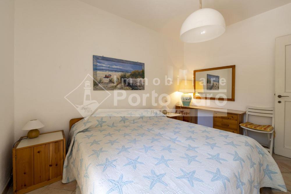 Posteľ alebo postele v izbe v ubytovaní 2 PINETA - Ampio quadrilocale sulla spiaggia di Porto Faro