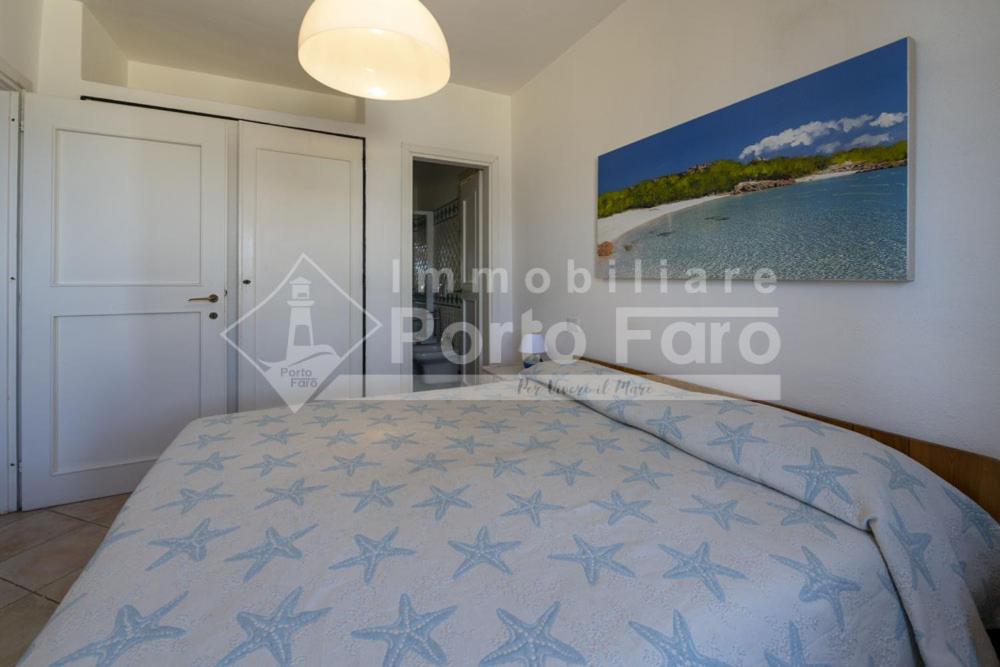 Posteľ alebo postele v izbe v ubytovaní 2 PINETA - Ampio quadrilocale sulla spiaggia di Porto Faro