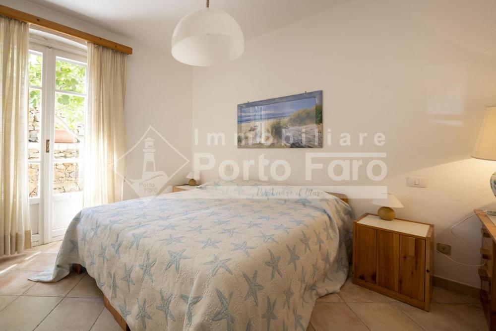 Posteľ alebo postele v izbe v ubytovaní 2 PINETA - Ampio quadrilocale sulla spiaggia di Porto Faro