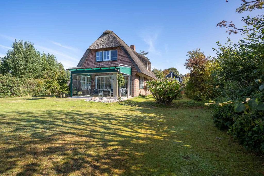 Aed väljaspool majutusasutust Hus Dünenkieker SPO Hus Dünenkieker SPO