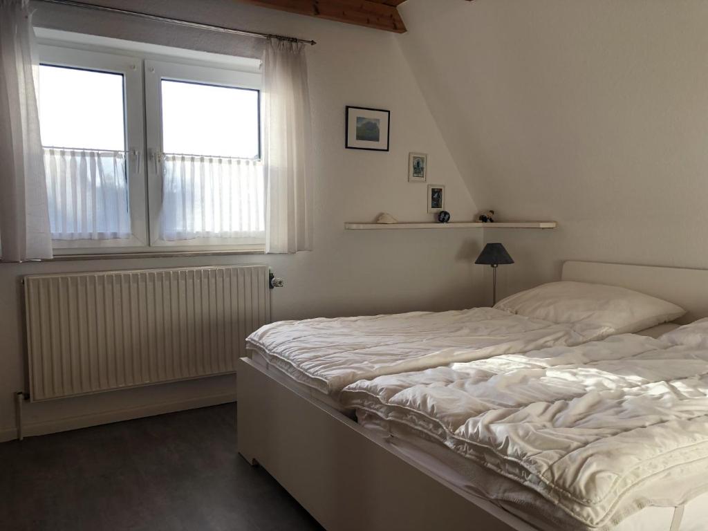 Postel nebo postele na pokoji v ubytování Blaue Oase Ferienhaus