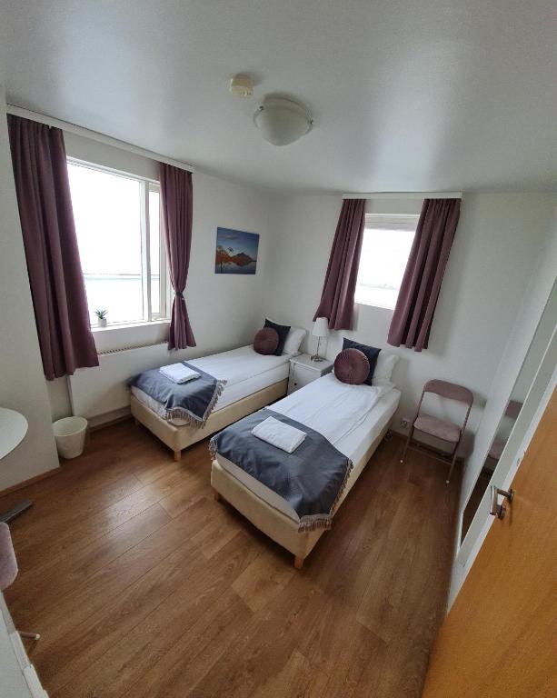 Postel nebo postele na pokoji v ubytování Höfn Guesthouse