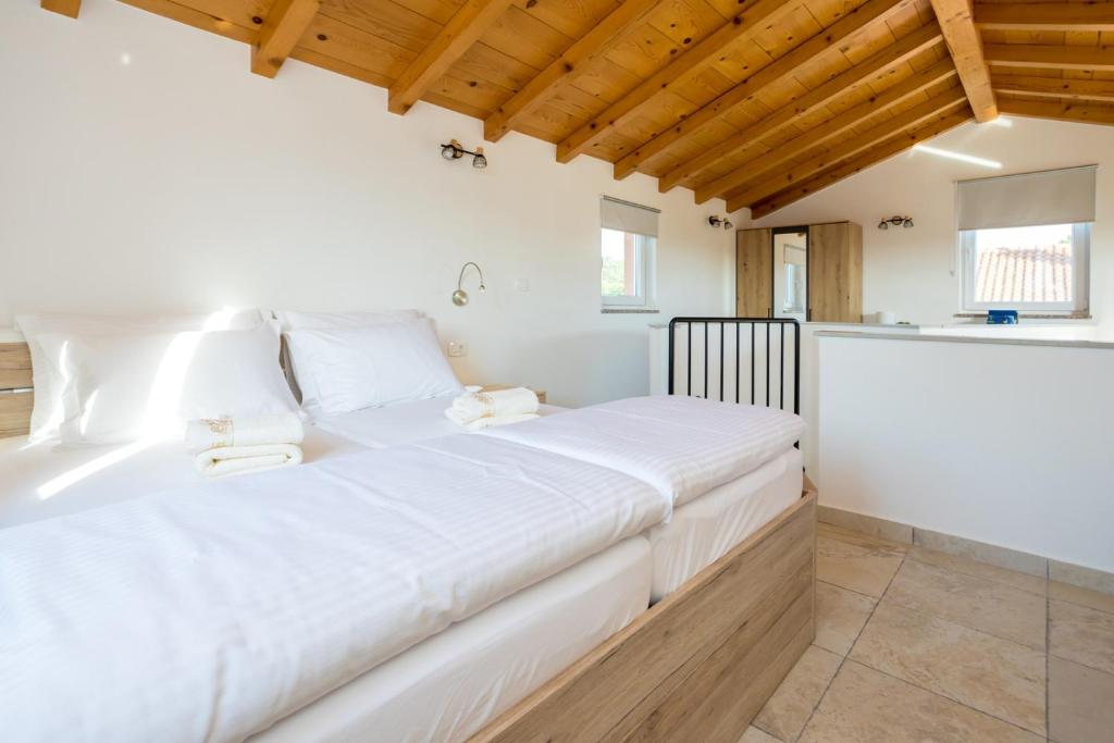Łóżko lub łóżka w pokoju w obiekcie Holiday house TOIĆI