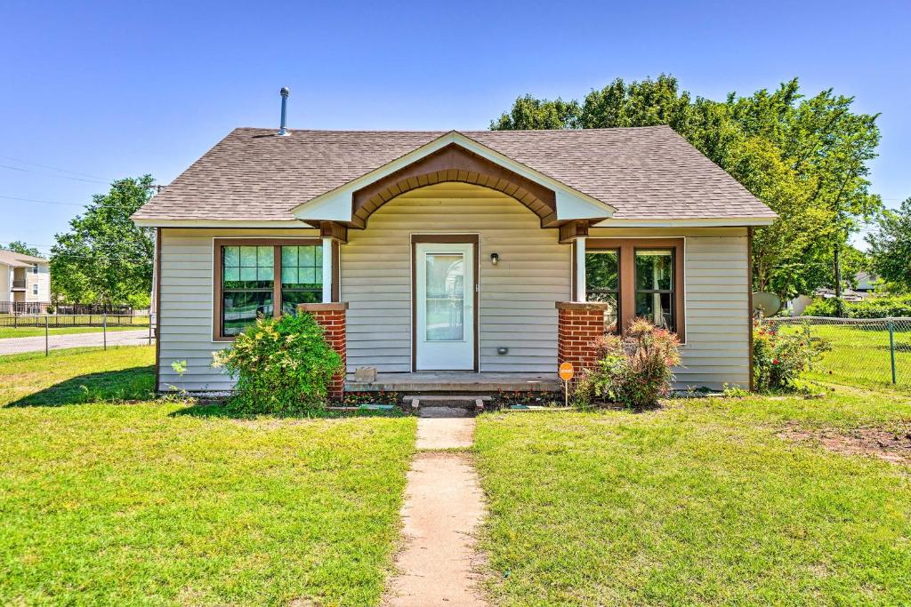 a small house with a pathway in front of it at Centrally Located Lawton Home Dogs Welcome! in Lawton