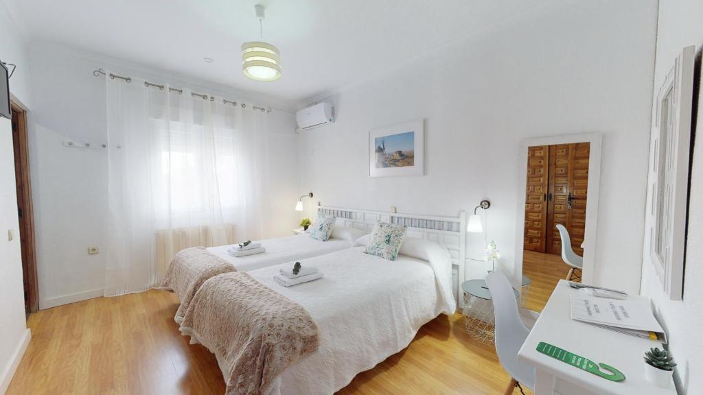 Postel nebo postele na pokoji v ubytování Hotel Consuegra