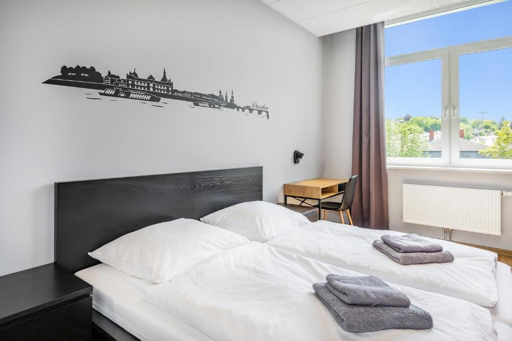 Postel nebo postele na pokoji v ubytování Hostel Am Windberg