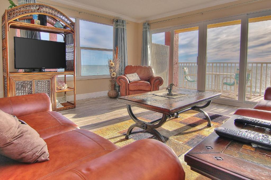 a living room with a couch and a coffee table at Ram Sea I 301 in St. Pete Beach