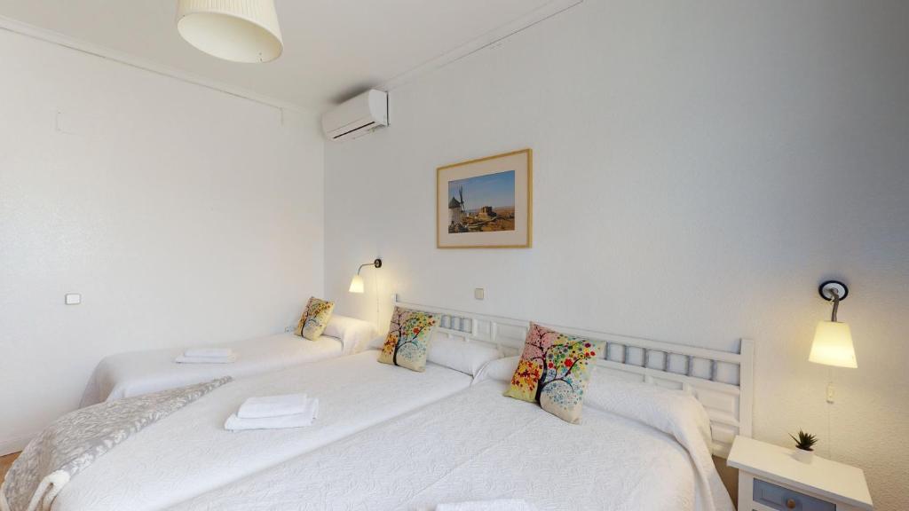Postel nebo postele na pokoji v ubytování Hotel Consuegra