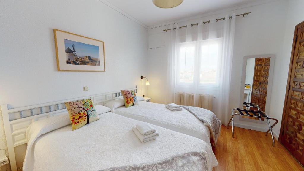Postel nebo postele na pokoji v ubytování Hotel Consuegra