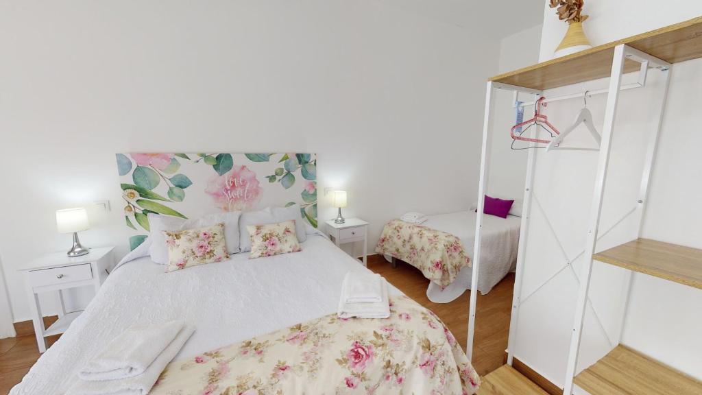 Postel nebo postele na pokoji v ubytování Hotel Consuegra