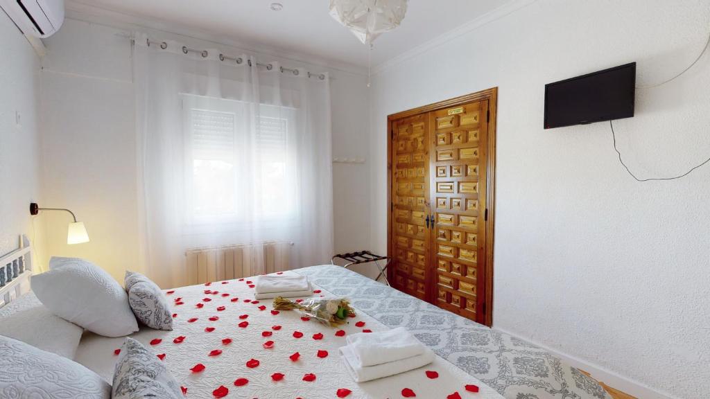 Postel nebo postele na pokoji v ubytování Hotel Consuegra