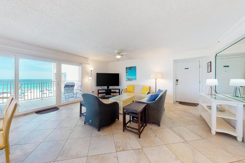 a living room with a view of the ocean at Holiday Villas III 201 in Clearwater Beach