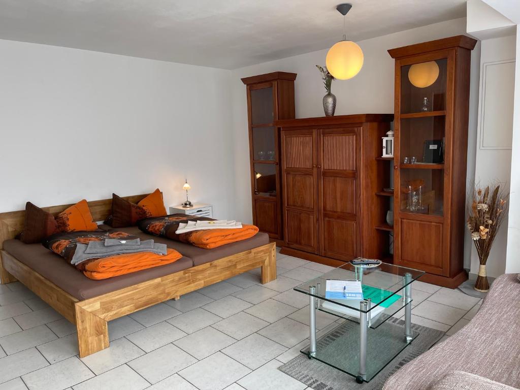 a living room with a couch and a table at Apartment am Kurpark in Bad Kösen