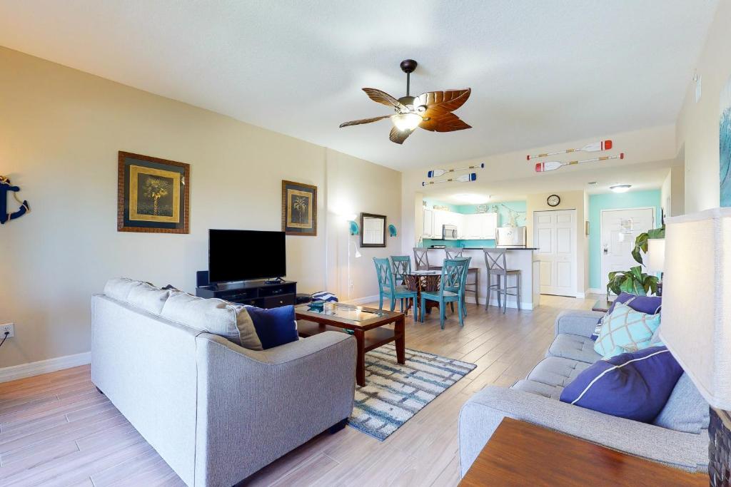 a living room with a couch and a table at Madeira Bay Resort 509 in St. Pete Beach