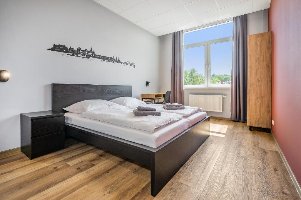 Postel nebo postele na pokoji v ubytování Hostel Am Windberg