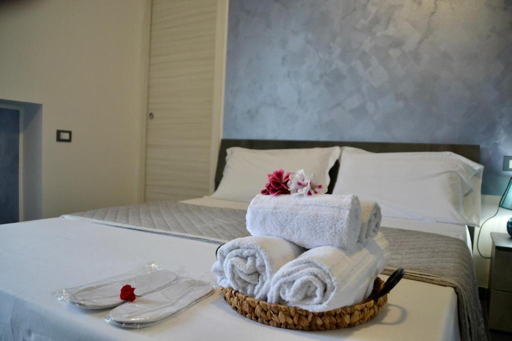 Postel nebo postele na pokoji v ubytování Sperlonga Paradise Suites 500m dal mare in estate Servizio navetta per Sperlonga centro