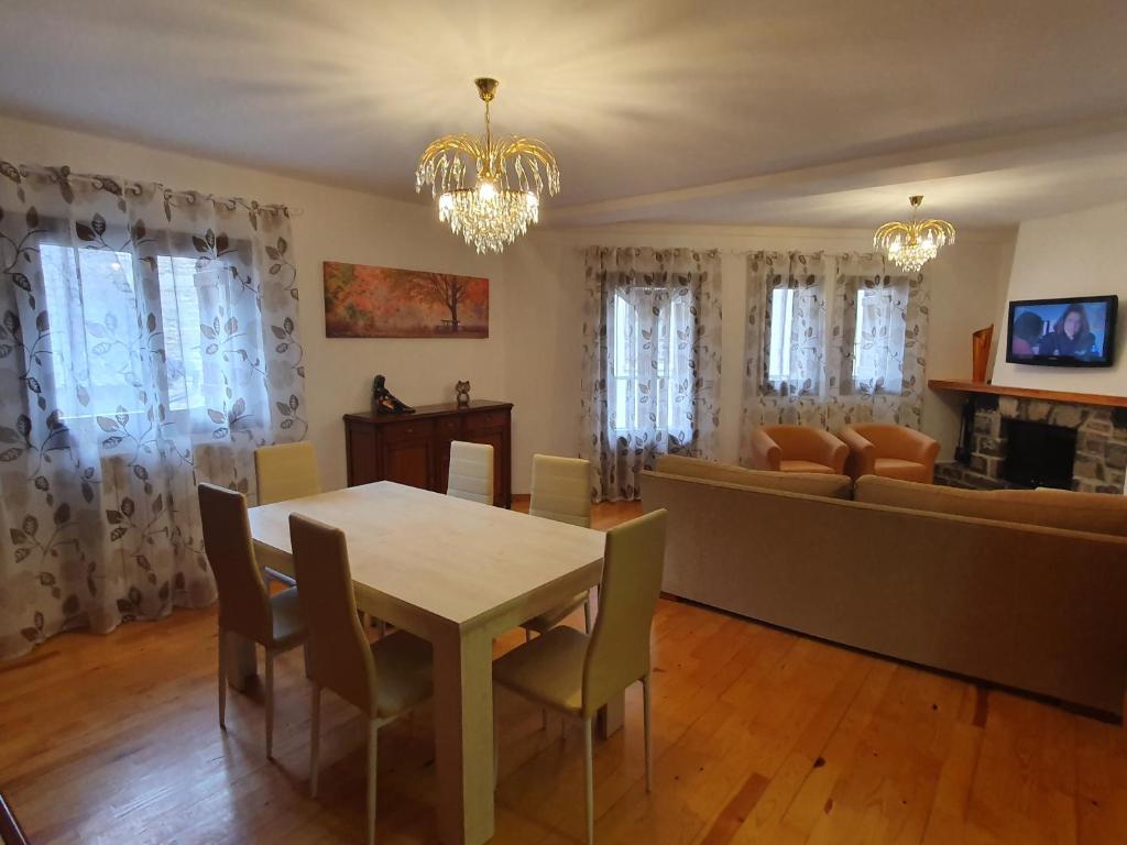 a living room with a table and a couch at Apartamento Marboré in Torla-Ordesa