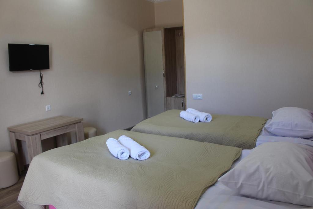 Postel nebo postele na pokoji v ubytování Hotel Rabati