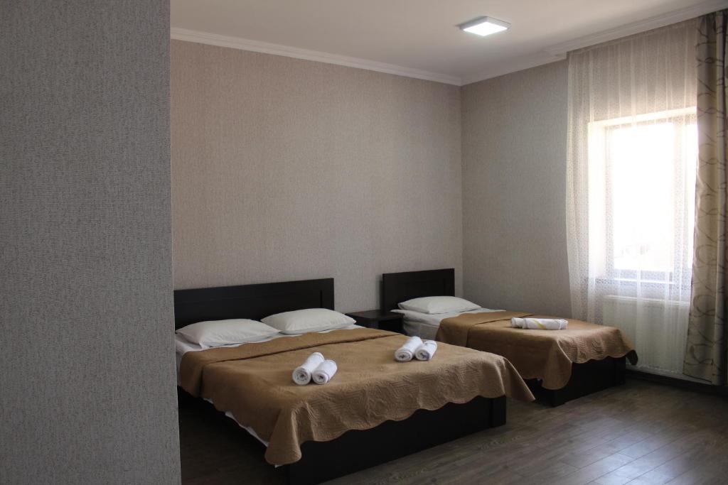 Postel nebo postele na pokoji v ubytování Hotel Rabati
