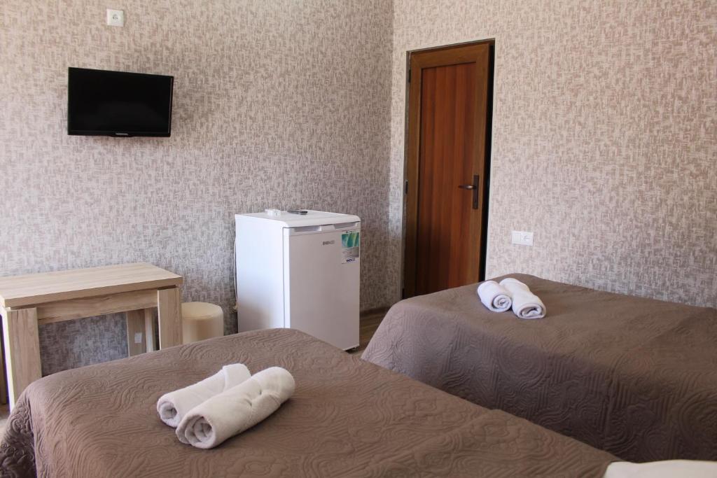 Postel nebo postele na pokoji v ubytování Hotel Rabati