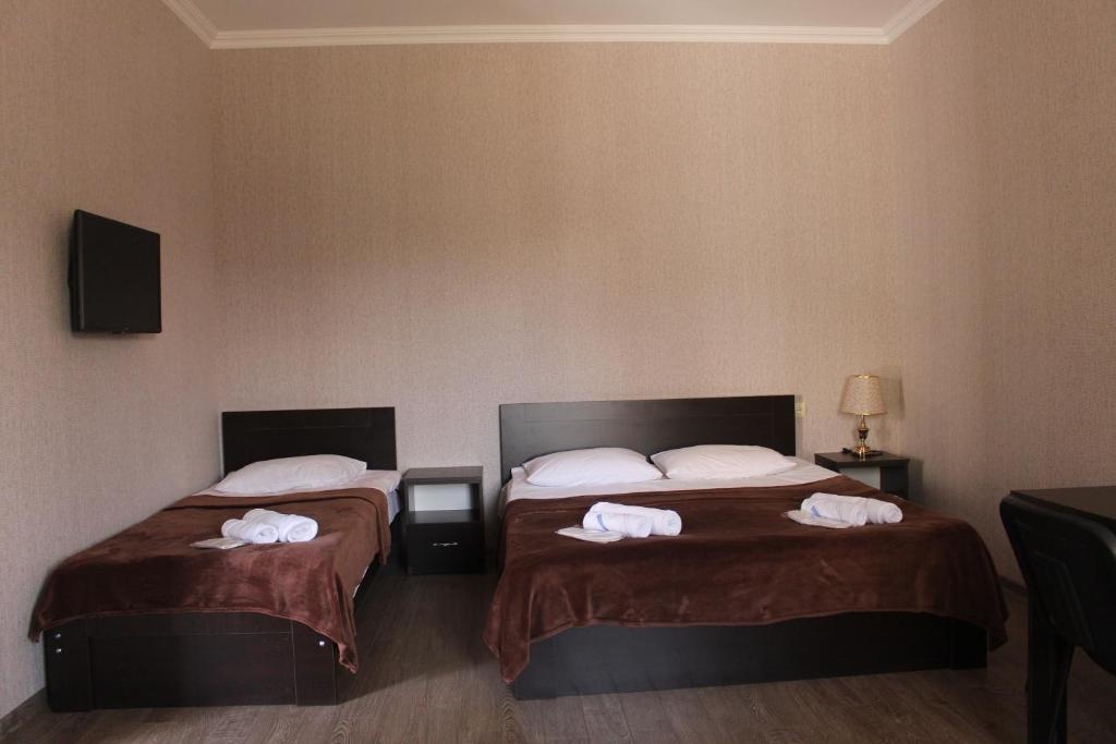 Postel nebo postele na pokoji v ubytování Hotel Rabati