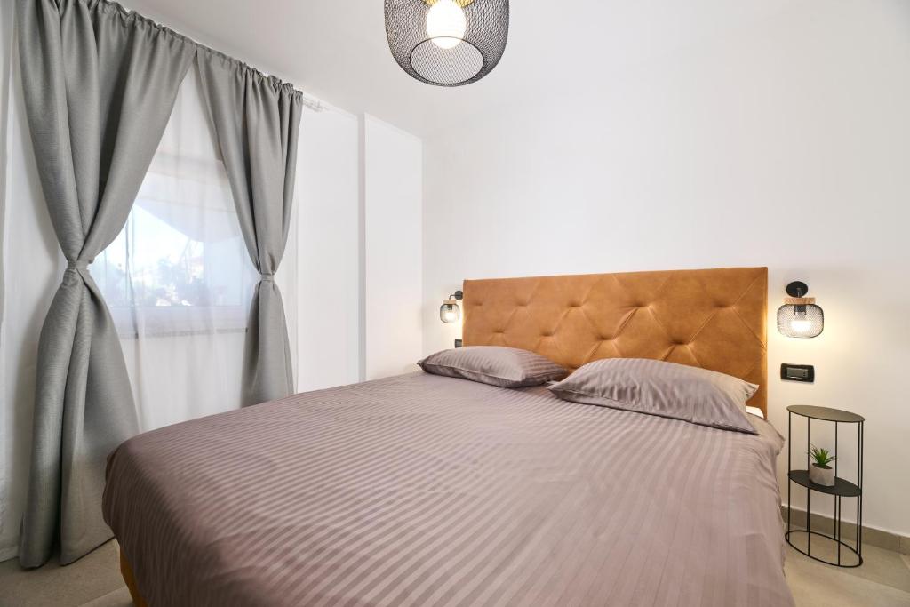 Łóżko lub łóżka w pokoju w obiekcie Apartments Dolcea