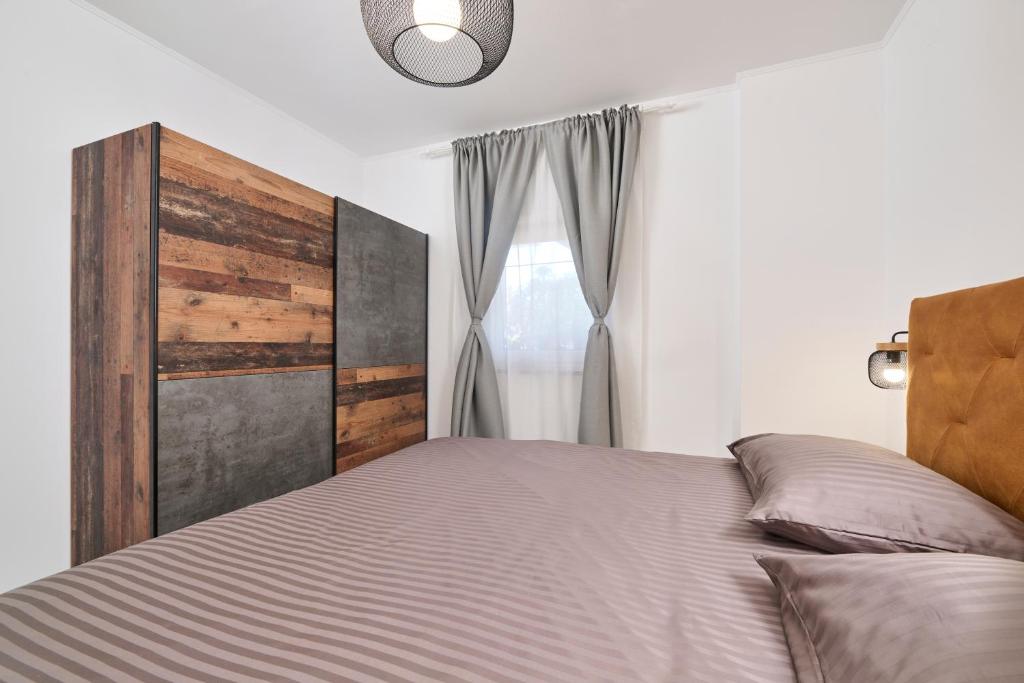 Łóżko lub łóżka w pokoju w obiekcie Apartments Dolcea