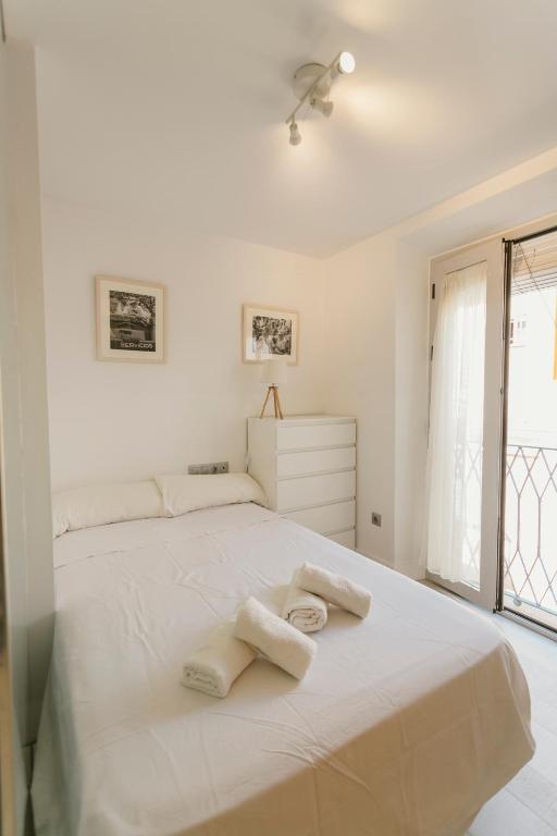A bed or beds in a room at Empecinado