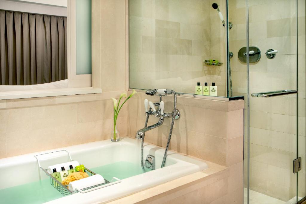 a bathroom with a bath tub with a shower at InterContinental Boston by IHG in Boston