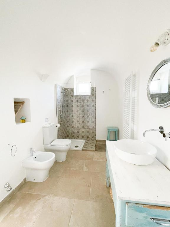 Koupelna v ubytování Trullo San Vincenzo con Piscina