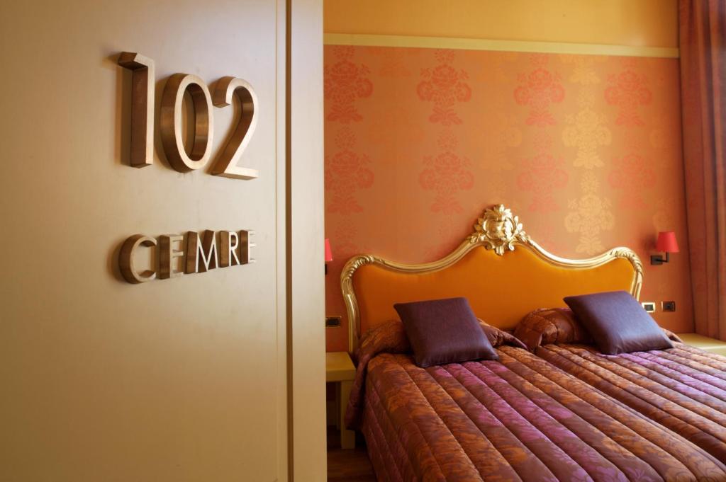 Łóżko lub łóżka w pokoju w obiekcie Hotel Ca' Zusto Venezia
