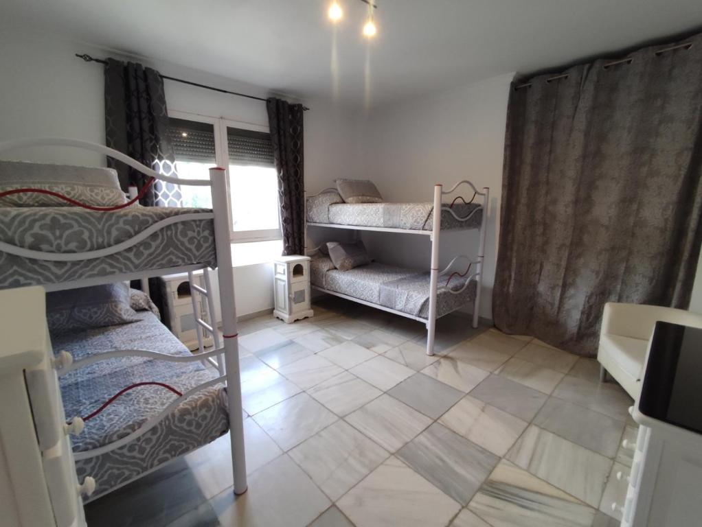 Posteľ alebo postele v izbe v ubytovaní Casa Rural La Promesa Granada