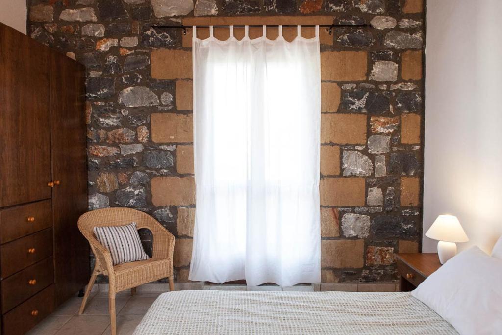 A bed or beds in a room at Io