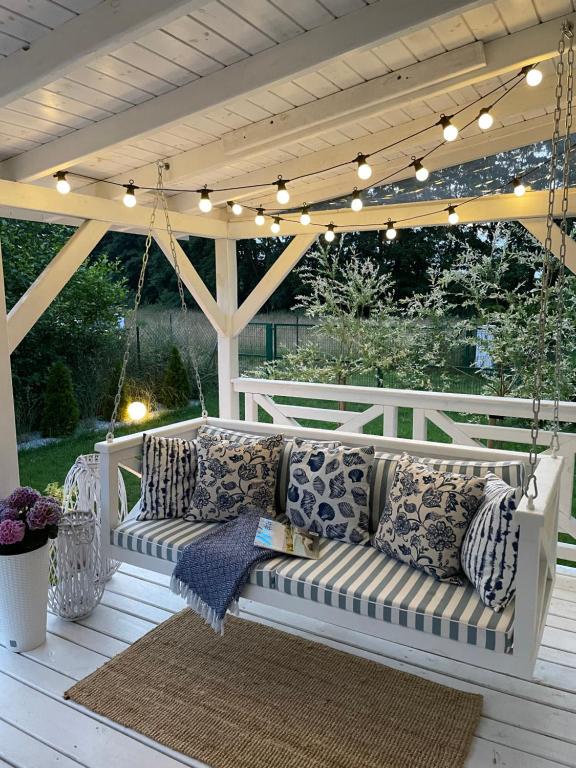 Ein Sitzbereich in der Unterkunft Domek holenderski Hampton