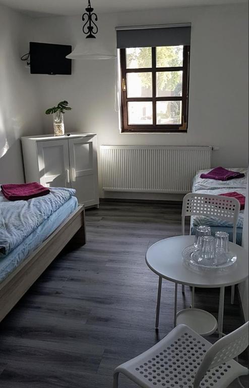 Postel nebo postele na pokoji v ubytování Statek U Dubu