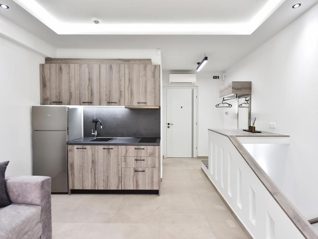 Kuchyň nebo kuchyňský kout v ubytování Christina Suites