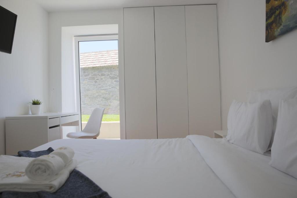 Postel nebo postele na pokoji v ubytování House Nobrega of Madeira