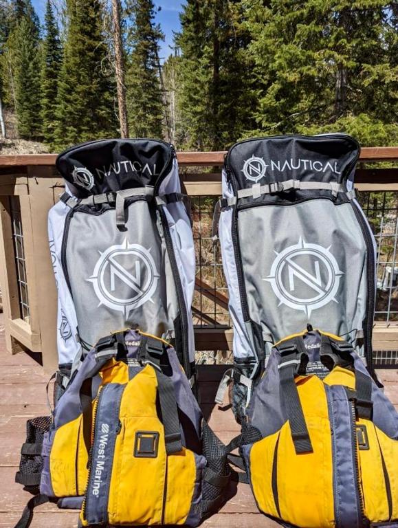 two backpacks sitting next to each other on a deck at Jackson Hole Hideout in Wilson