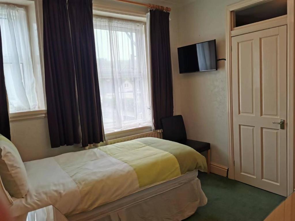 Postel nebo postele na pokoji v ubytování Athol Park Guest House