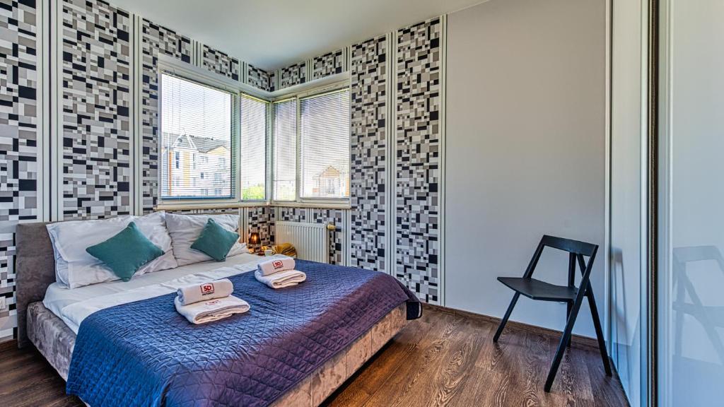 Posteľ alebo postele v izbe v ubytovaní Apartament Maki - 5D Apartamenty