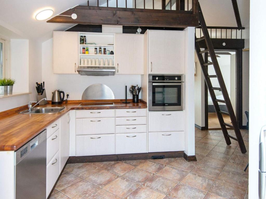 Kuchyň nebo kuchyňský kout v ubytování Holiday home Toftlund XLII