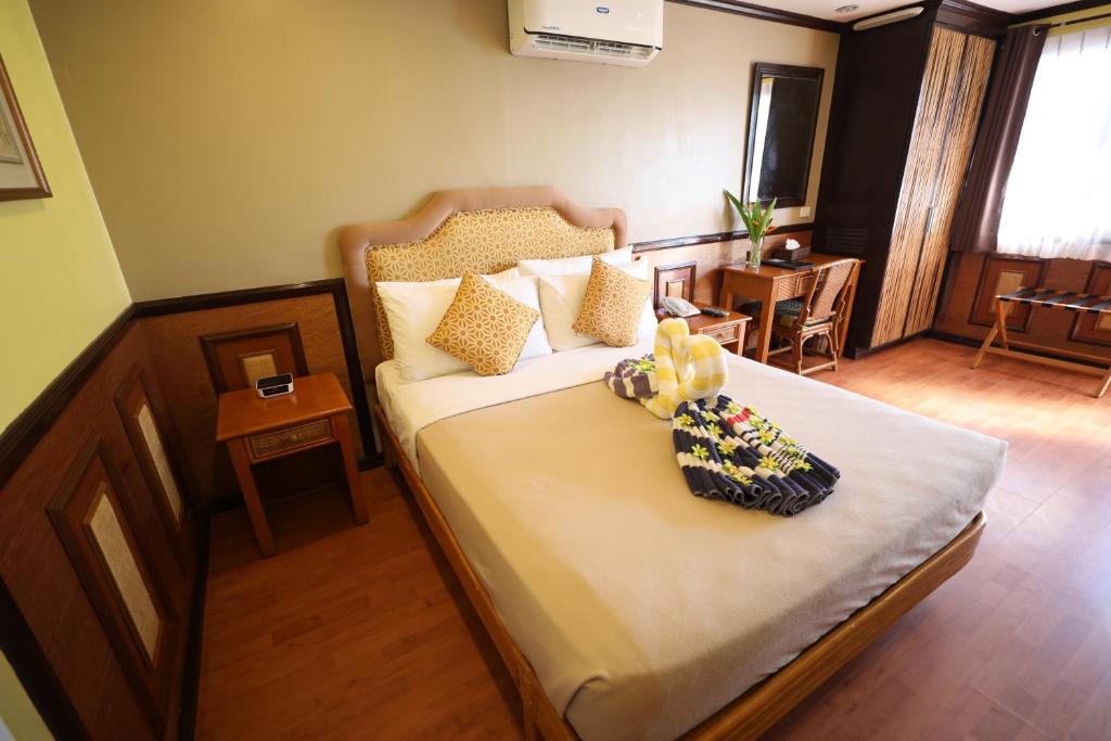 Postel nebo postele na pokoji v ubytování Red Coco Inn de Boracay